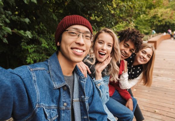 Group of mixed race teens doing a selfie transition to adulthood